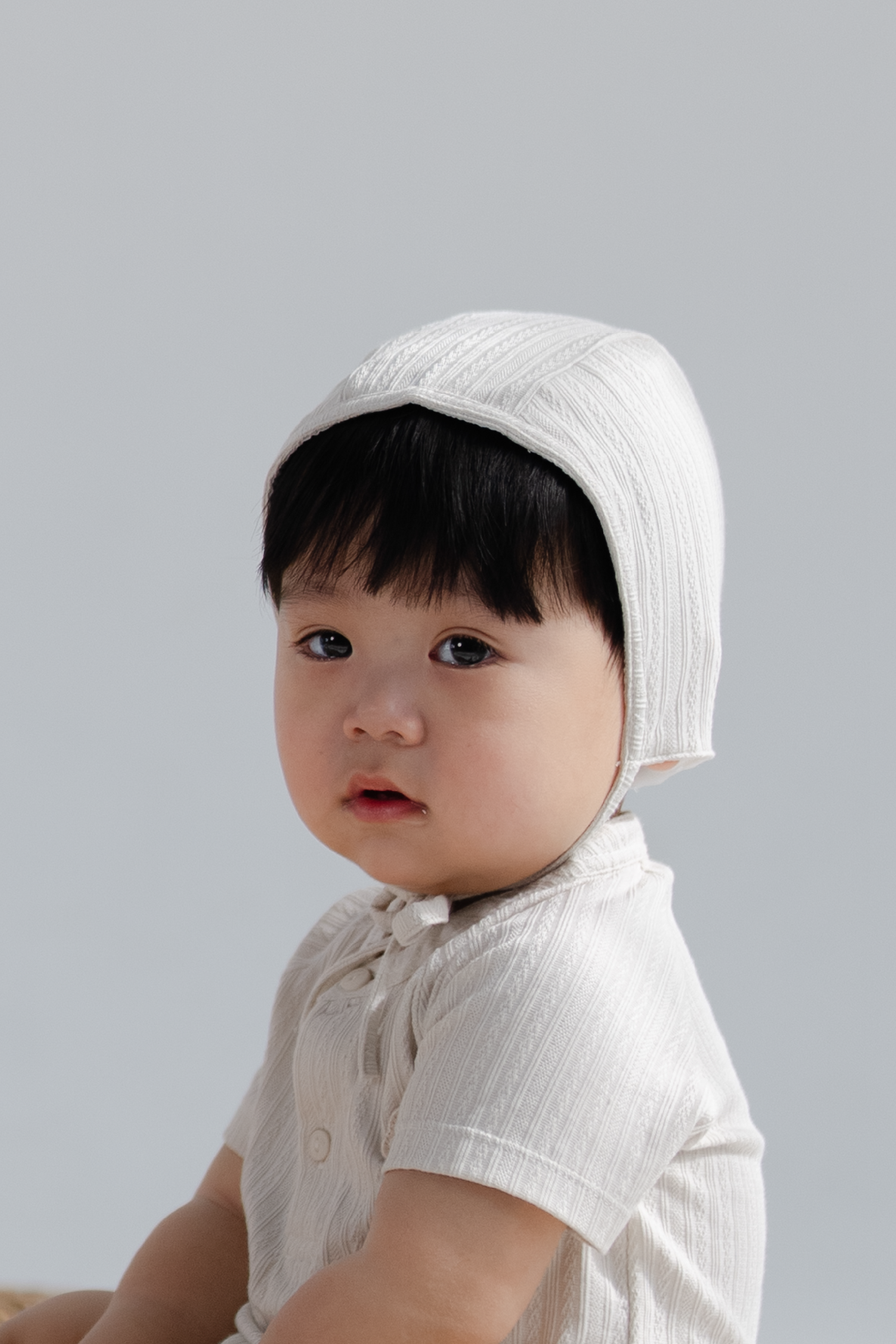 KindKnit Baby Unisex Bonnet in Taupe