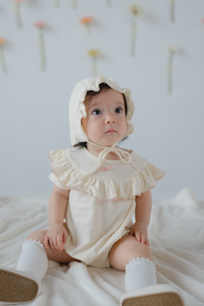 KindKnit Millie Onesie in Buttercream
